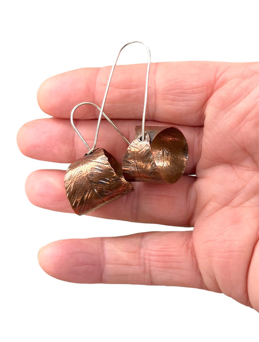 Copper curled leaf earrings.